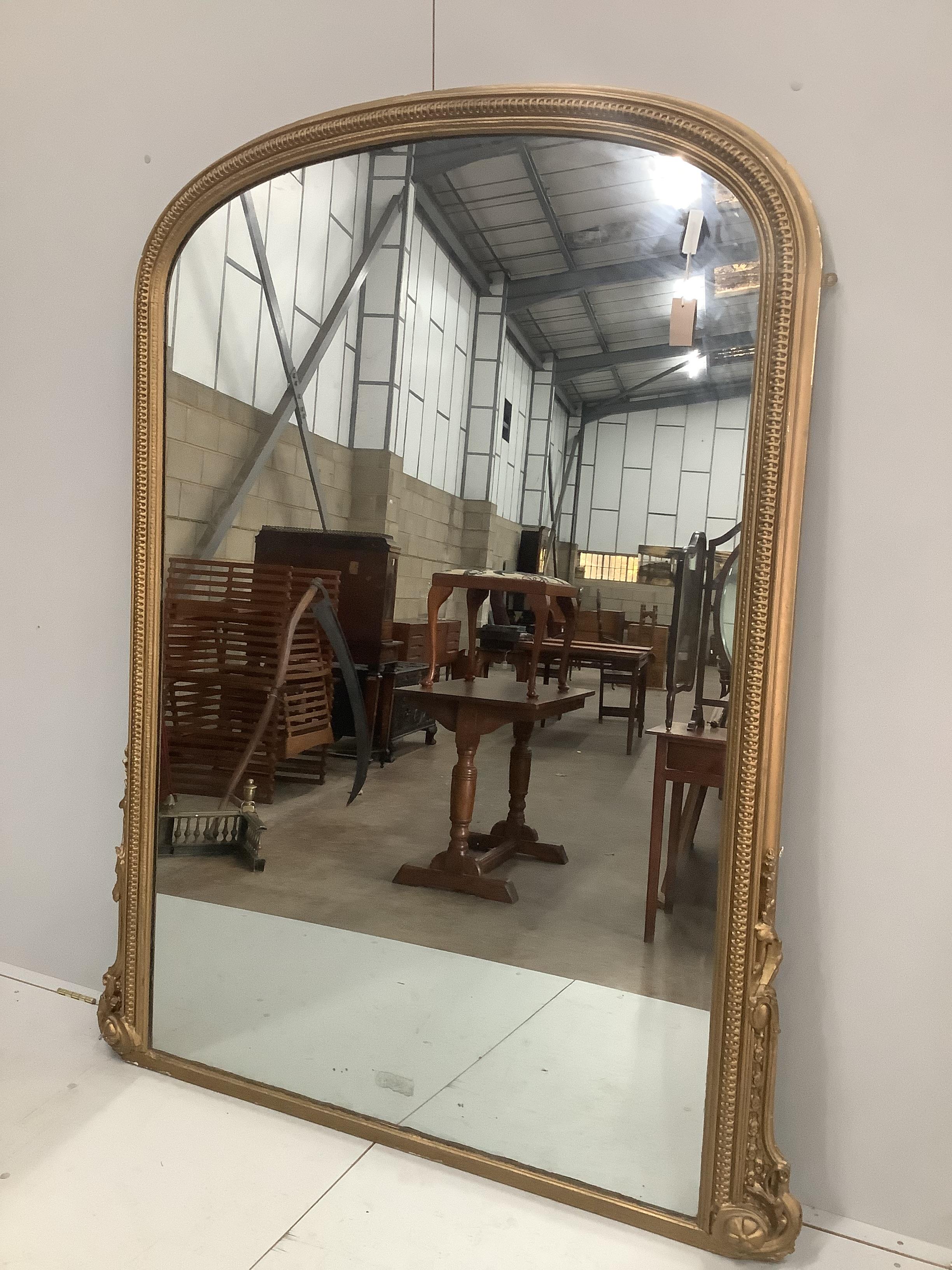 A Victorian giltwood and composition overmantel mirror, width 140cm, height 182cm